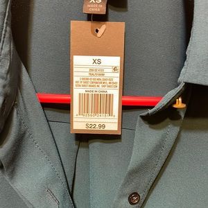 very cute womens dress top..never been worn... teal color..